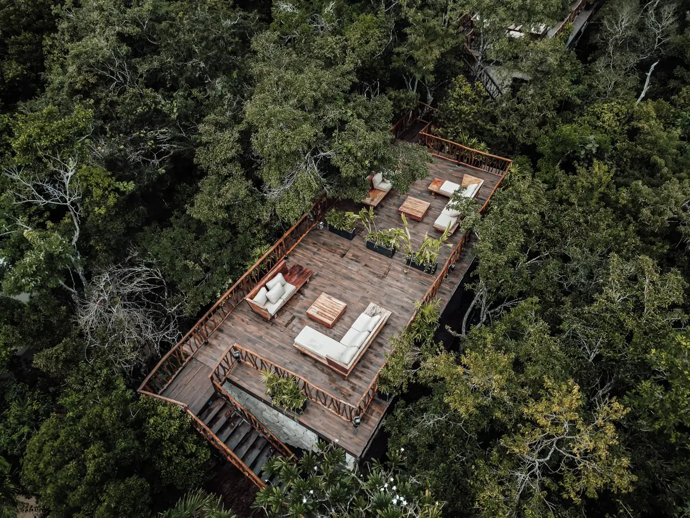Aerial view of a Kaaba Luum rooftop deck in the jungle canopy
